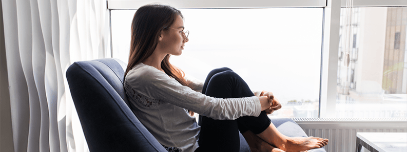 Depressed woman on chair