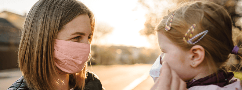 Putting mask on child